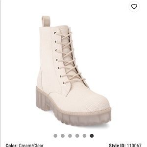 Cream snakeskin combat boots.